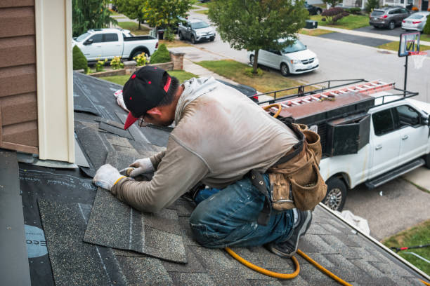 Professional Gutter Repair And Installation technician working in Glen Oaks, NY